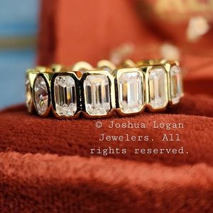 Oval Emerald Moissanite eternity band in 18K yellow gold over sterling silver